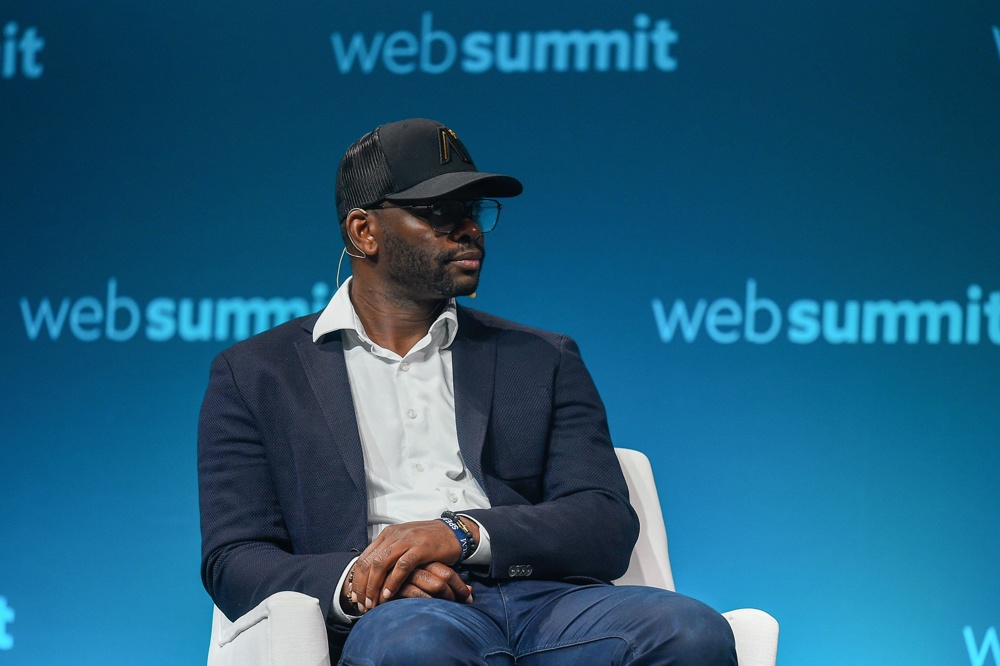 Former Manchester United forward Louis Saha speaks at a press conference.