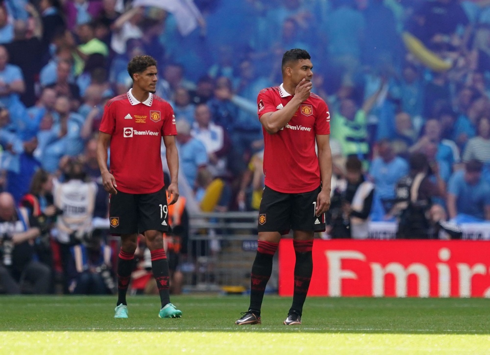 image of varane and casemiro wearing united kit