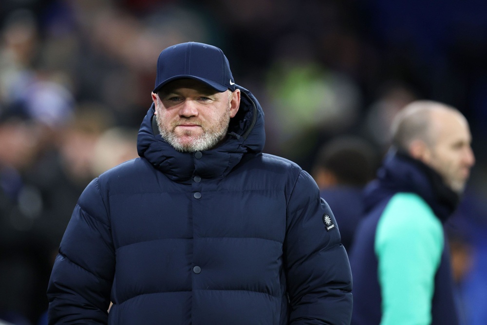 photo of wayne rooney in a cap and puffer jacket while manager of birmingham city football club