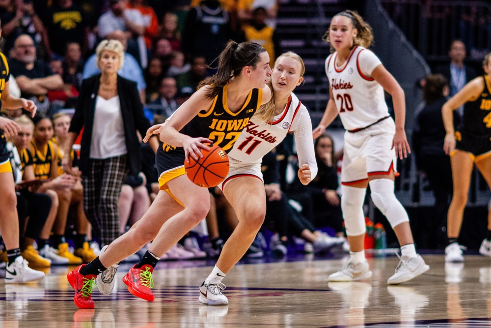 Charlotte, NC, USA. 9th Nov, 2023. Iowa Hawkeyes guard Caitlin Clark (22) drives around Virginia Tech Hokies guard Matilda Ekh (11) during the fourth quarter of the Ally Tipoff 2023 matchup at Spectrum Center in Charlotte, NC. (Scott Kinser/CSM). Credit: csm/Alamy Live News - Image ID: 2T6E2M5