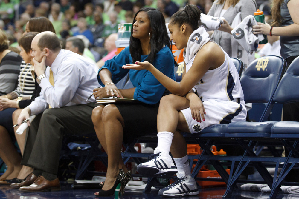Feb. 5, 2012 - South Bend, Indiana, U.S - Notre Dame guard Skylar Diggins (#4) talks with assistant coach Niele Ivey during NCAA Women's basketball game between DePaul and Notre Dame. The Notre Dame Fighting Irish defeated the DePaul Blue Demons 90-70 in game at Purcell Pavilion at the Joyce Center - Image ID: C9PYPH