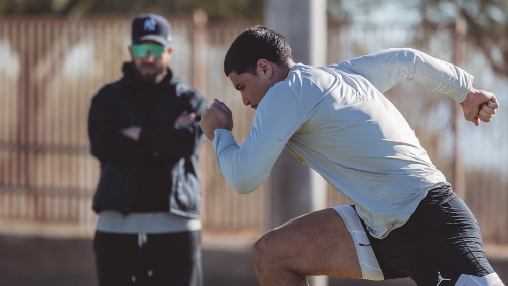 Laiatu Latu trains at EXOS in Phoenix as Nic Hill looks on closely